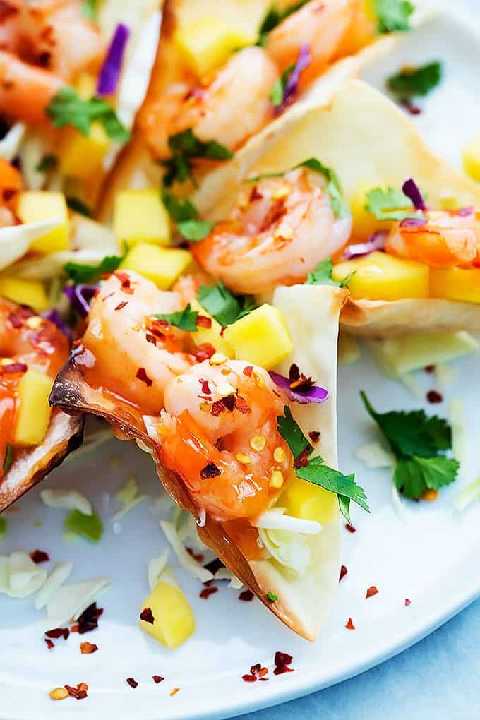 close up of firecracker shrimp wonton tacos on a plate.
