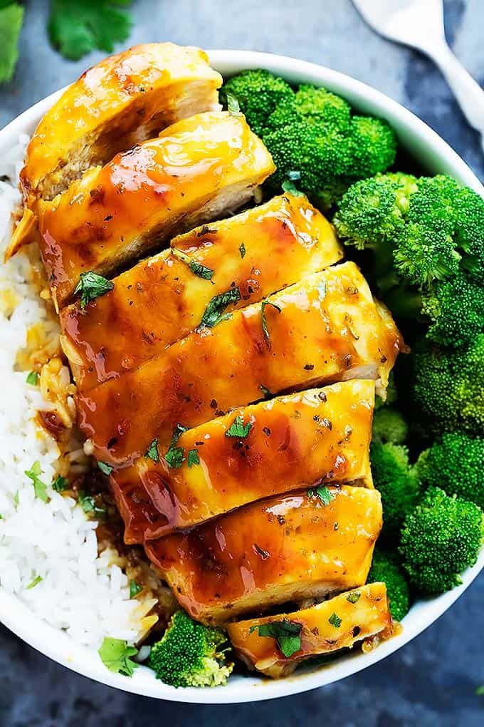 top view of baked honey mustard chicken with broccoli and rice in a bowl.