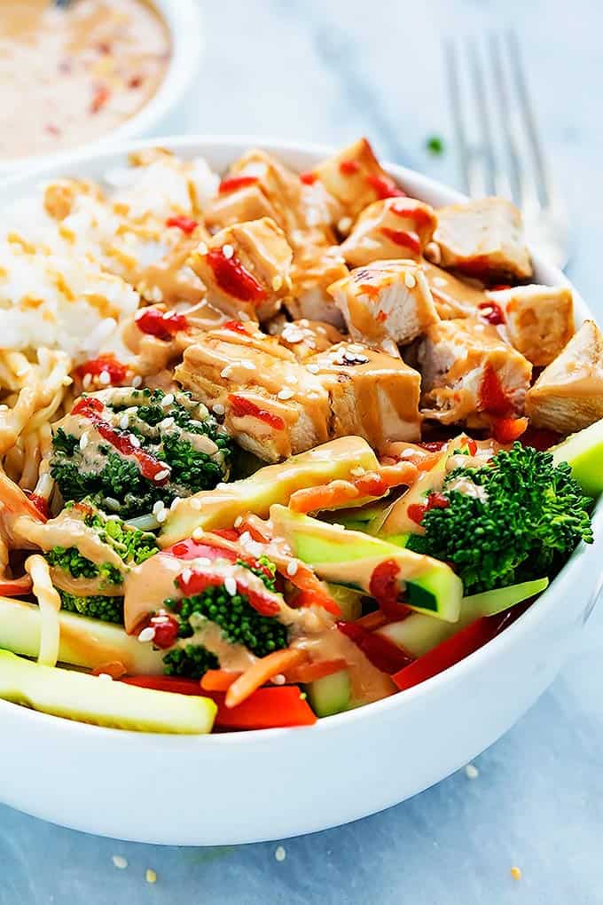 a Bali Island chicken rice bowl with a fork on the side.