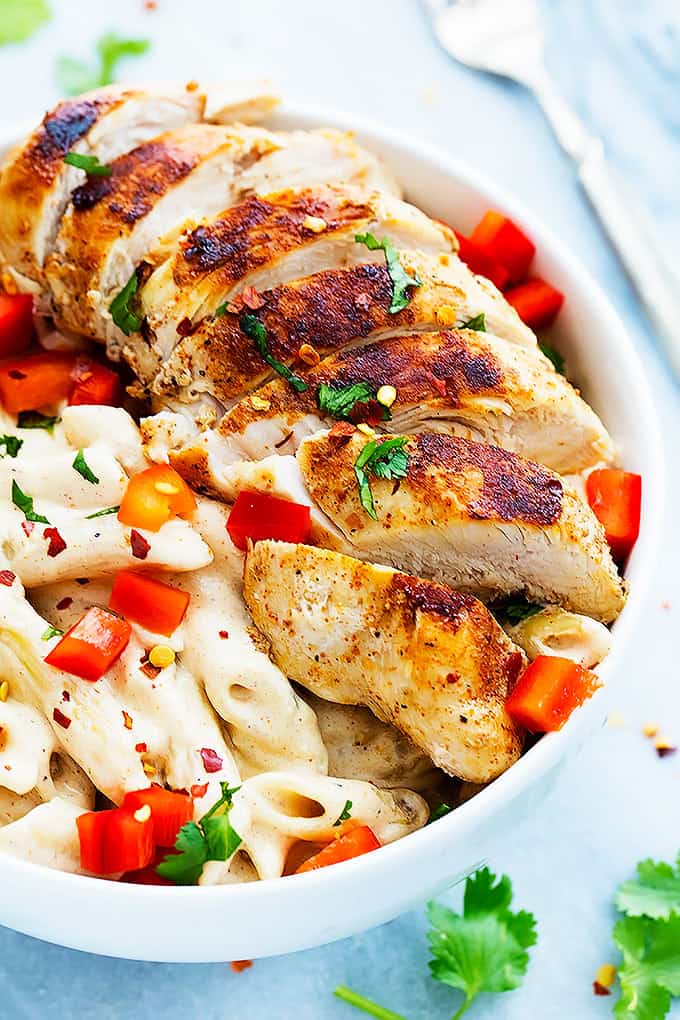 Chili's cajun alfredo pasta in a bowl with a fork on the side.