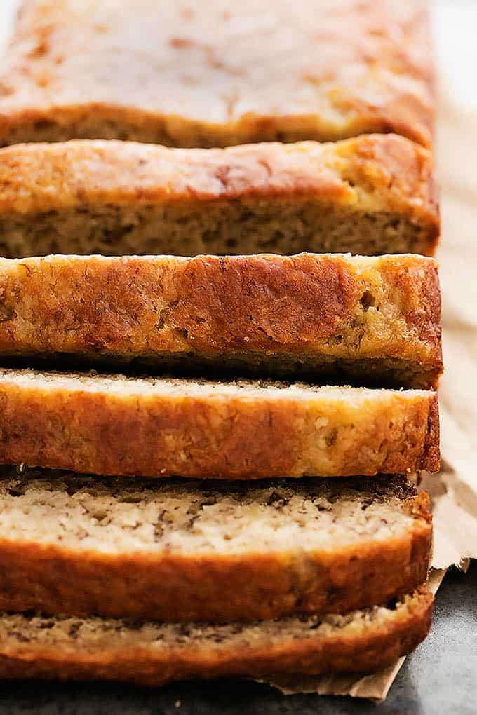 close up of greek yogurt banana bread with part of it sliced.