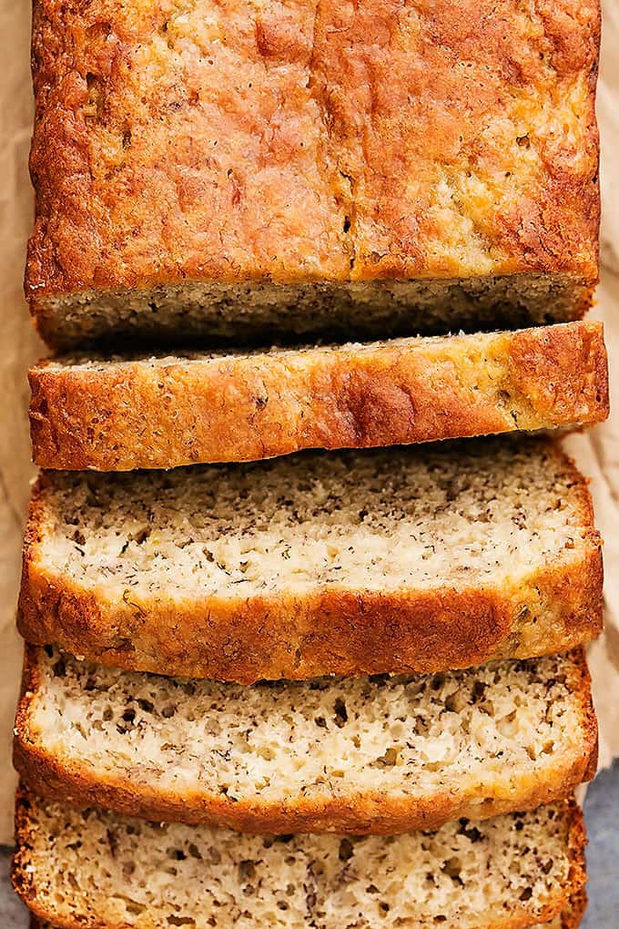 close up top view of greek yogurt banana bread with part of it sliced.