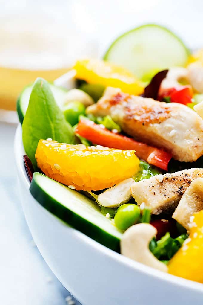 close up of Asian citrus chicken salad in a bowl.