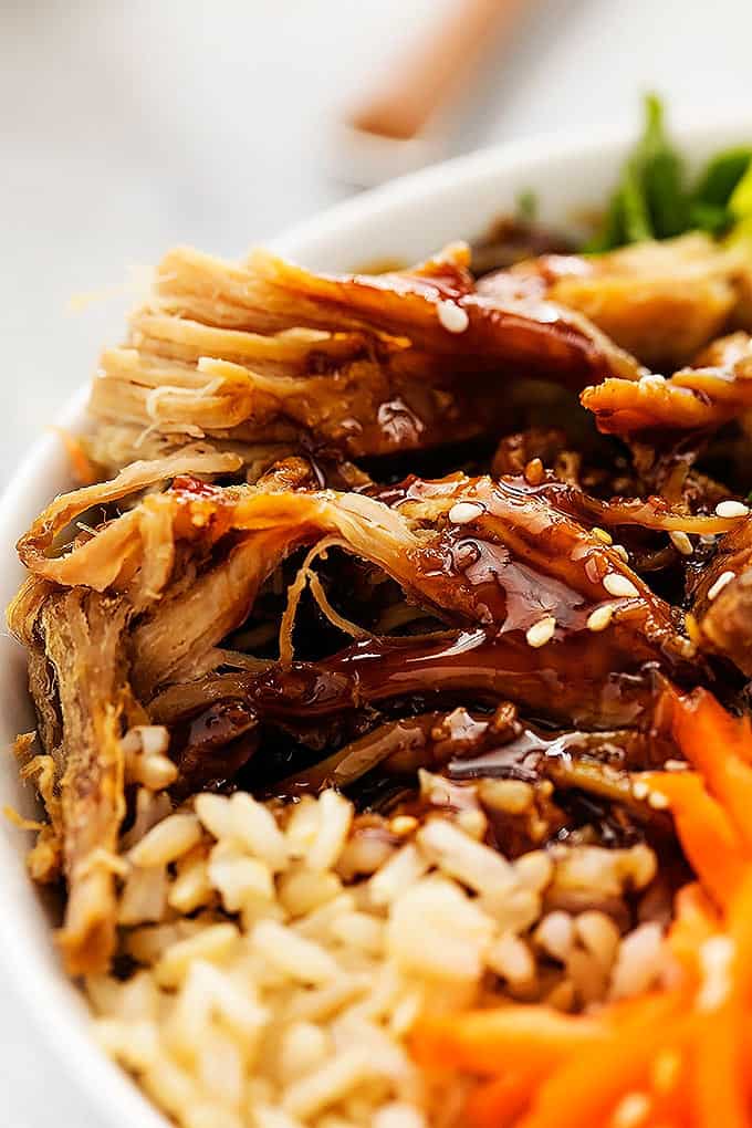 close up of the pork in a slow cooker luau pork rice bowl.