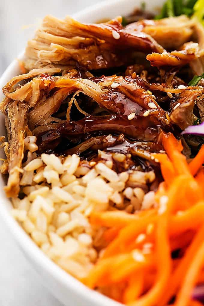 close up of the pork and rice in a slow cooker luau pork rice bowl.