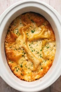 cooked white chicken lasagna in slow cooker.
