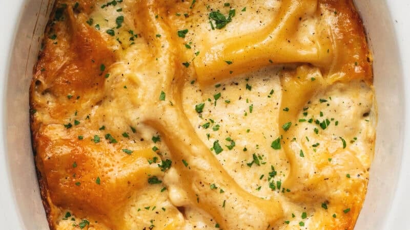 cooked white chicken lasagna in slow cooker.