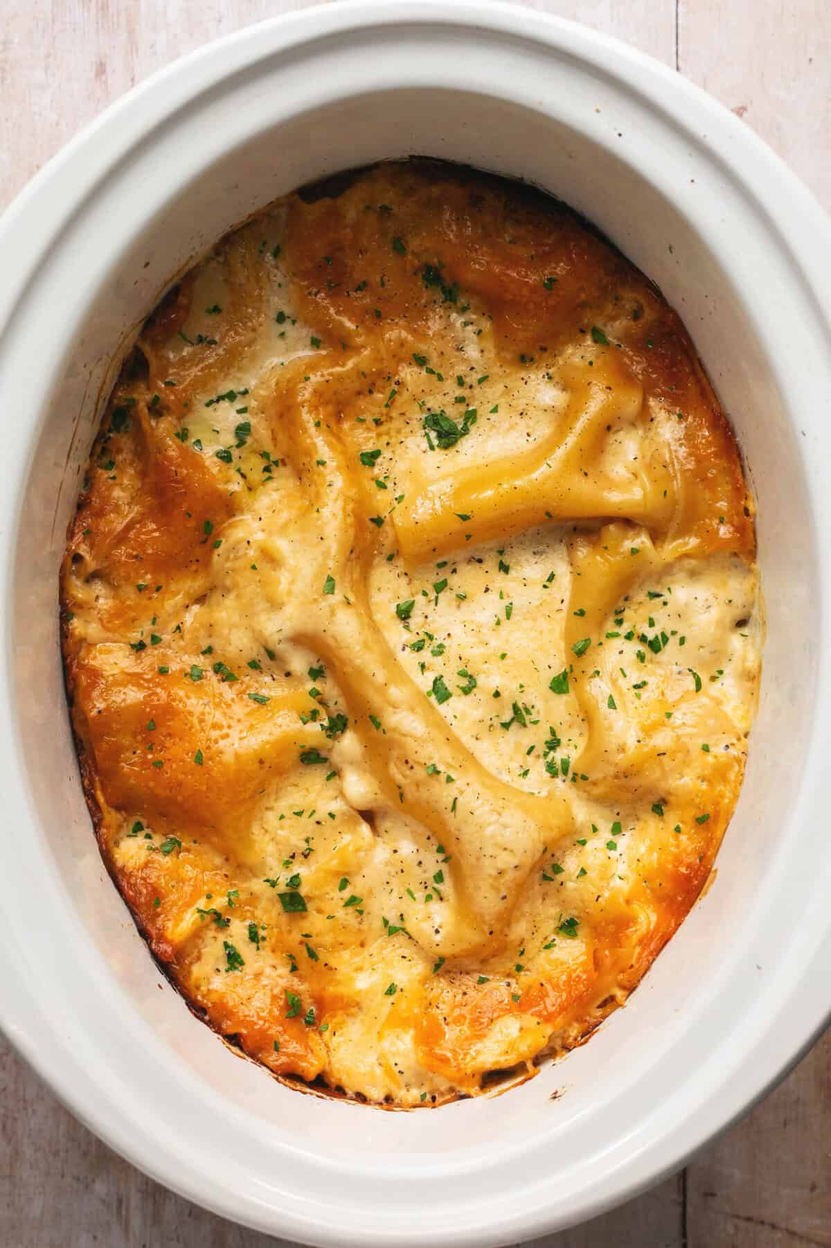 cooked white chicken lasagna in slow cooker.