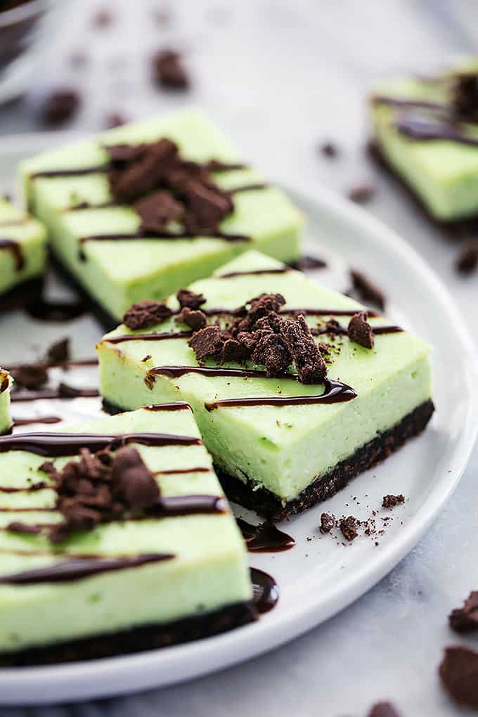 thin mint cheesecake bars on a plate.