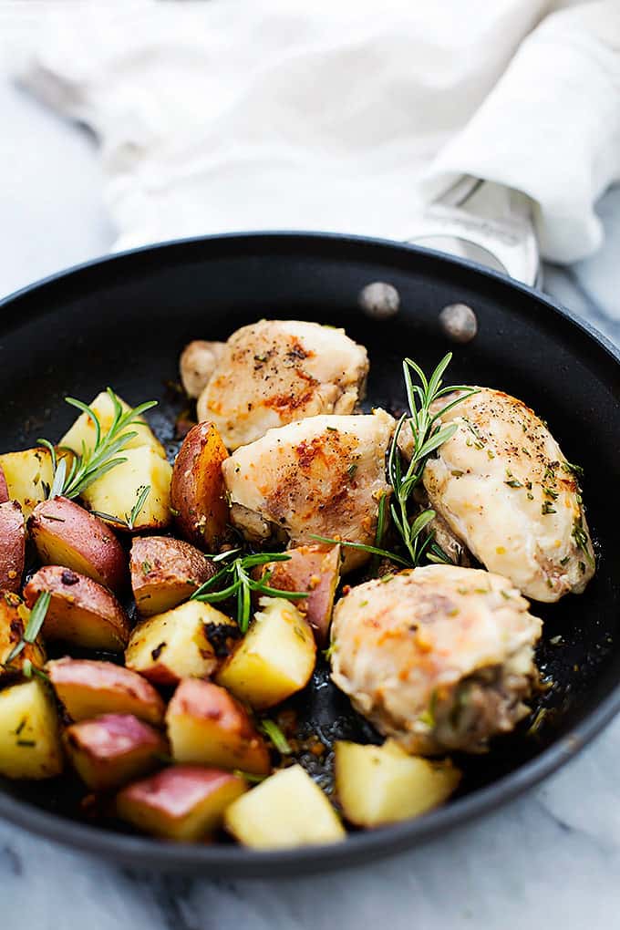 rosemary chicken and potatoes in a skillet.