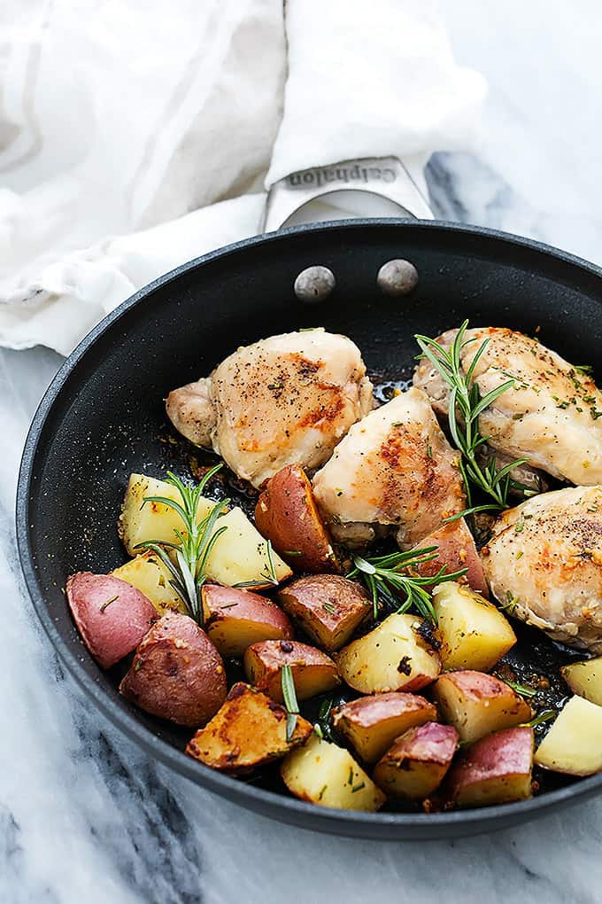 rosemary chicken and potatoes in a skillet.