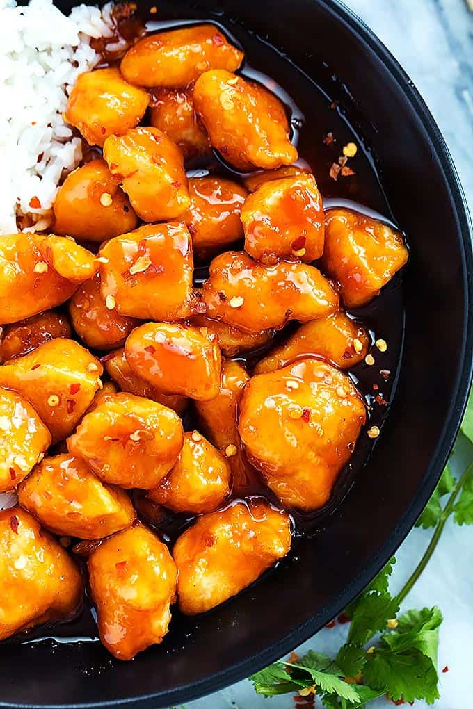 close up top view of slow cooker firecracker chicken with rice in a bowl.