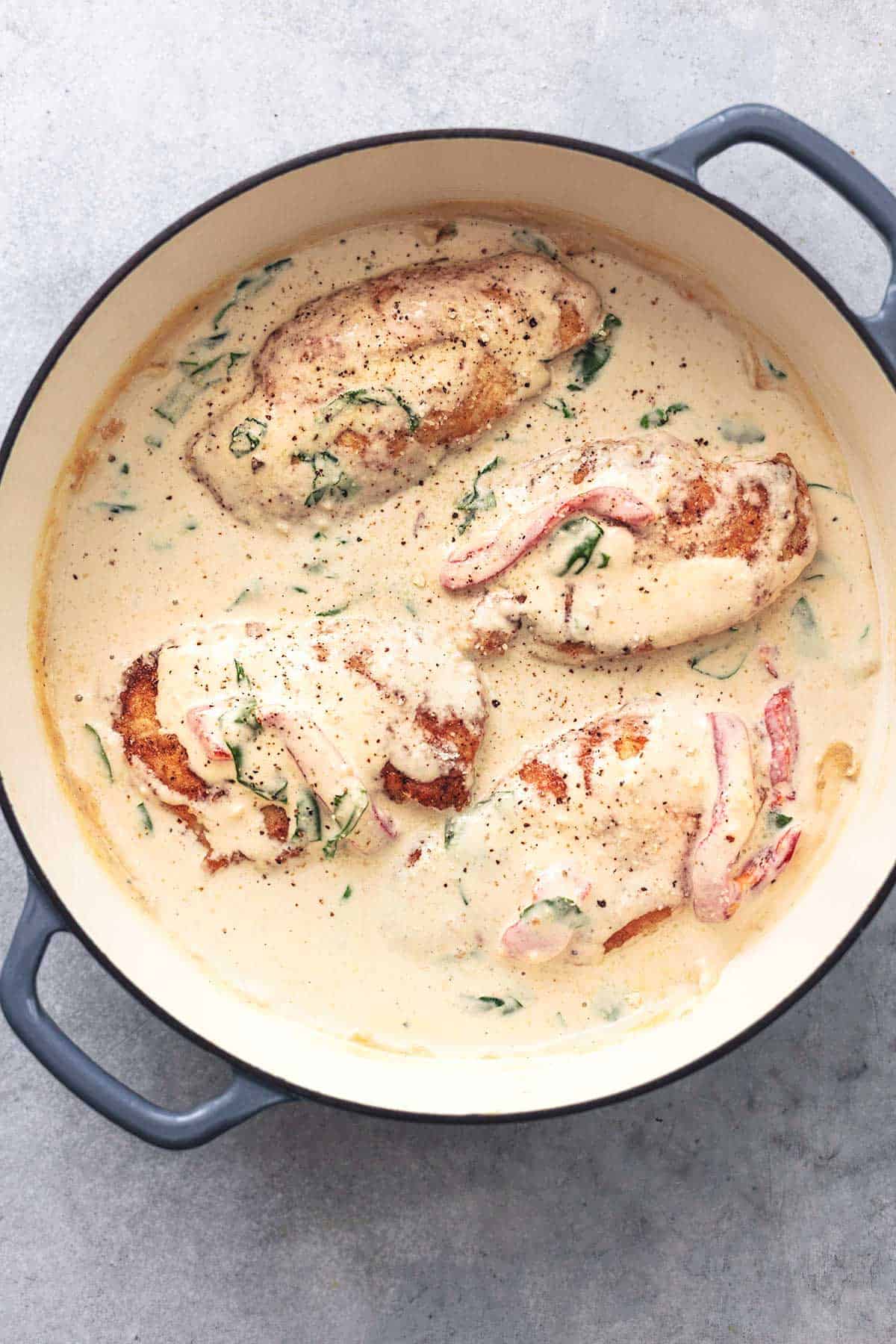 chicken covered with sauce in skillet