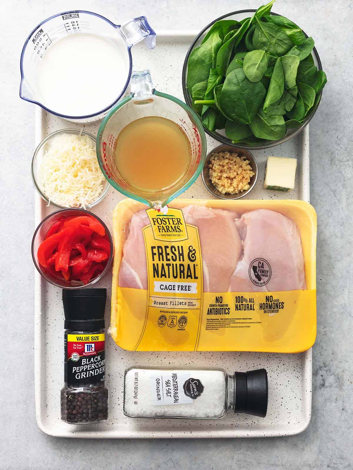 tuscan garlic chicken ingredients on sheet pan