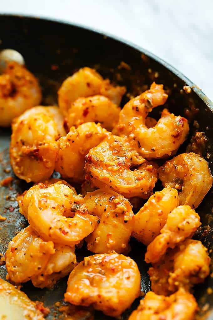 close up of Cajun shrimp  in a skillet.