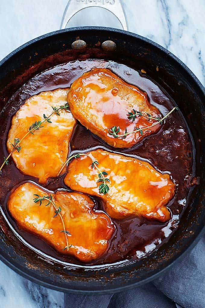 top view of maple glazed porkchops in a skillet.