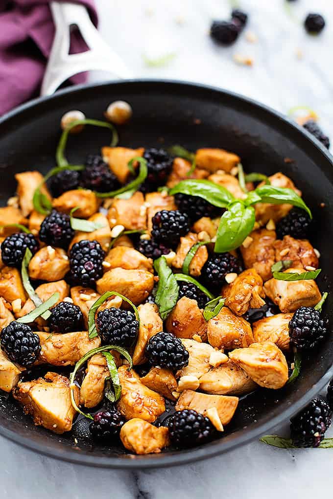 Thai blackberry basil chicken in a skillet.