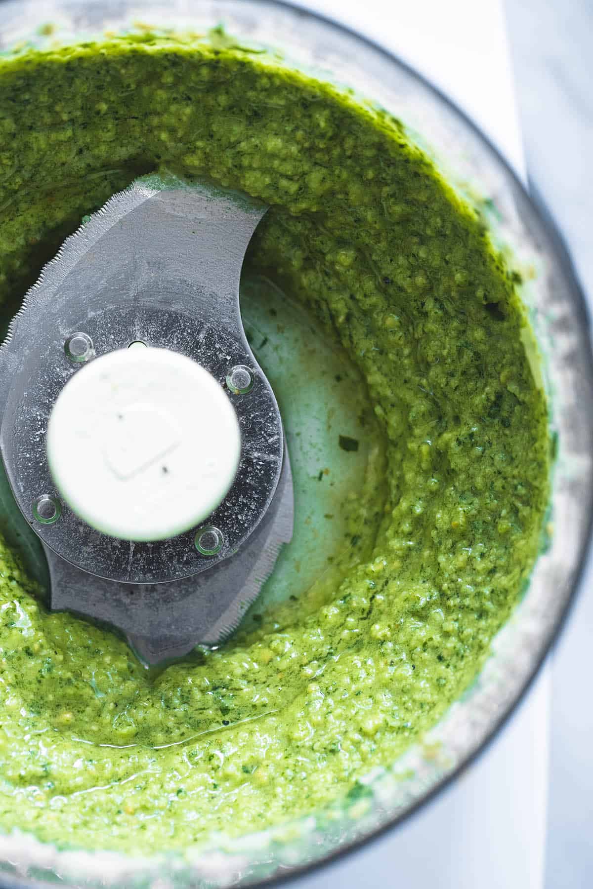 close up of cashew pesto in a blender.