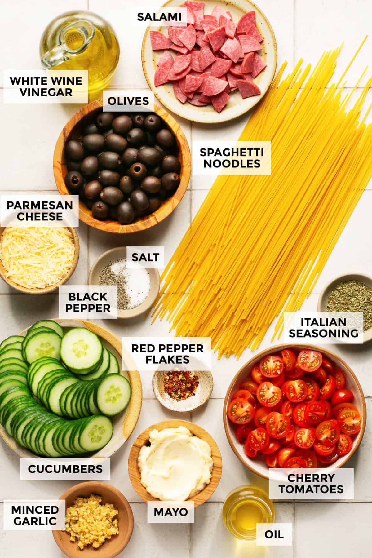 Ingredients for Italian spaghetti pasta salad with creamy dressing.