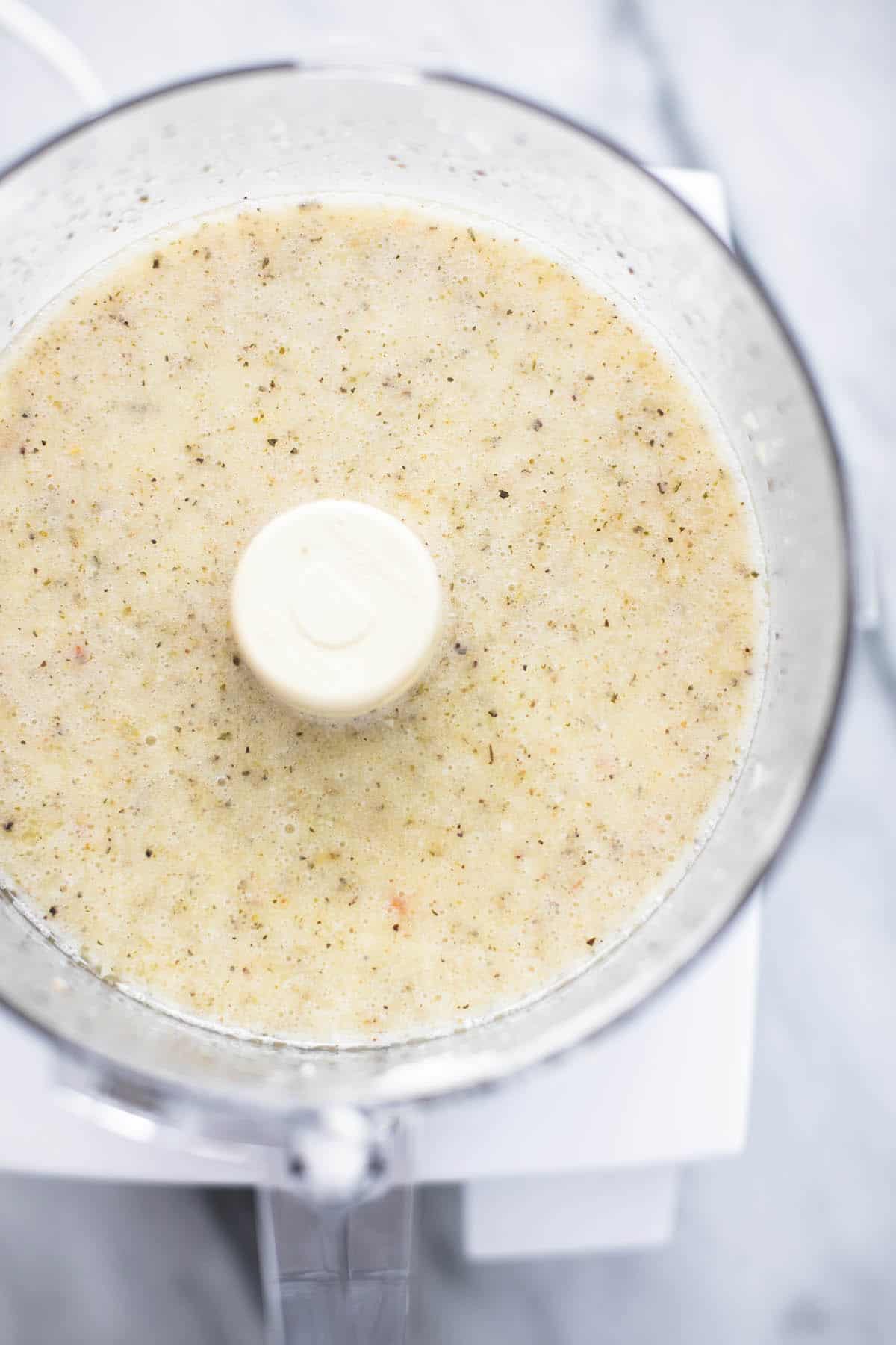 top view of creamy Italian dressing in a blender.