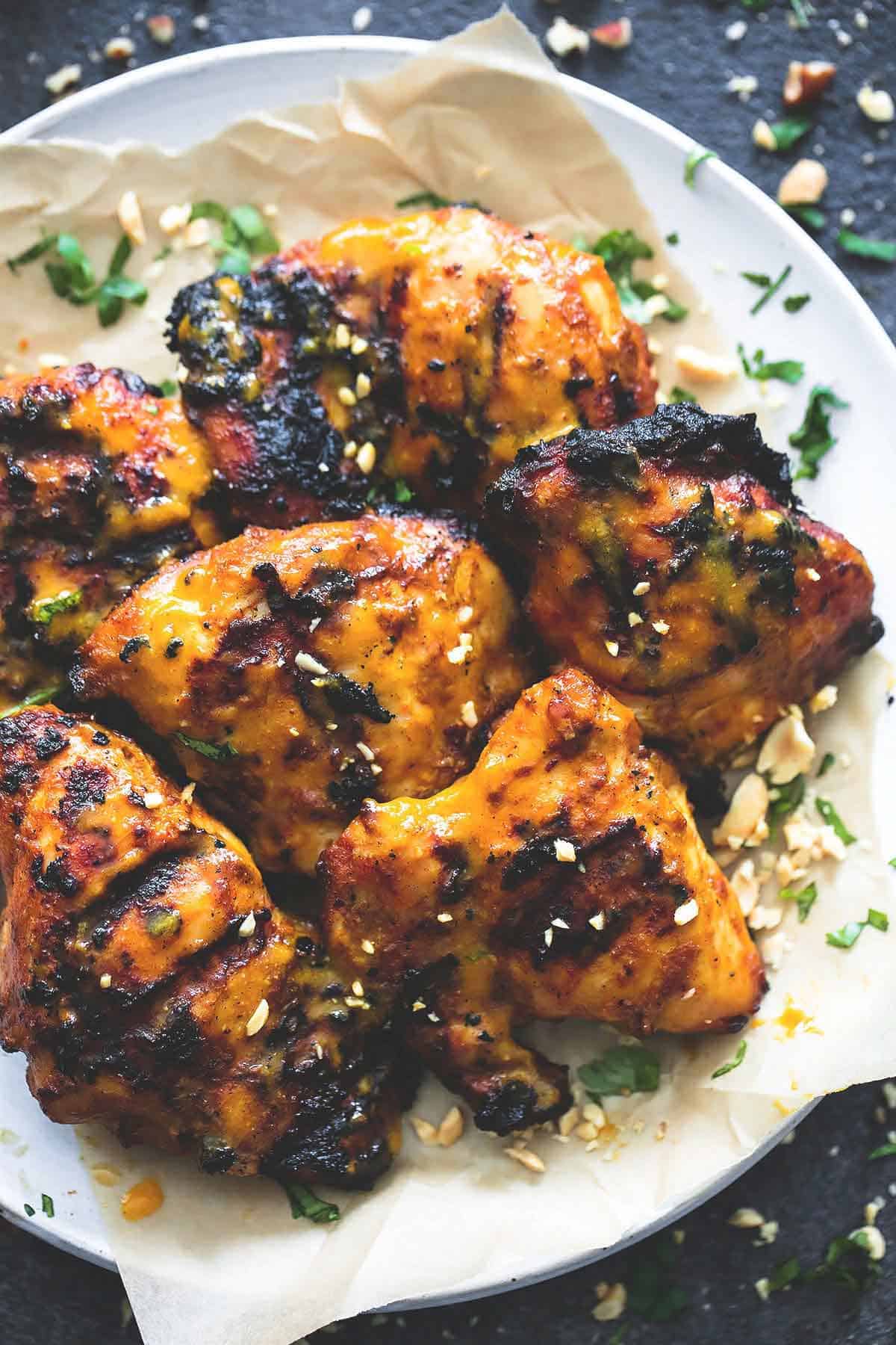 close up top view of grilled Thai mango chicken on a plate.