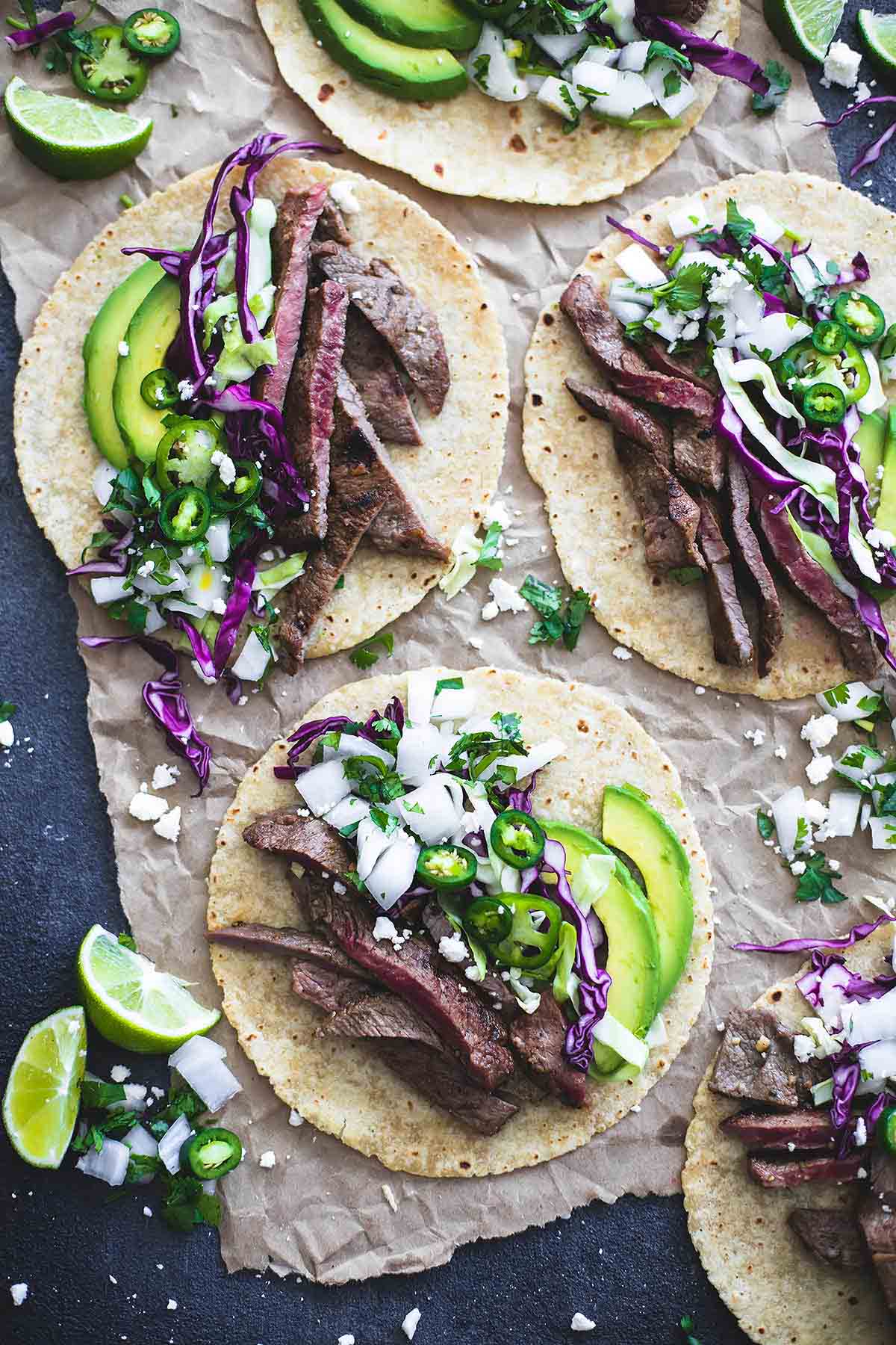 top view of open mojo steak tacos.