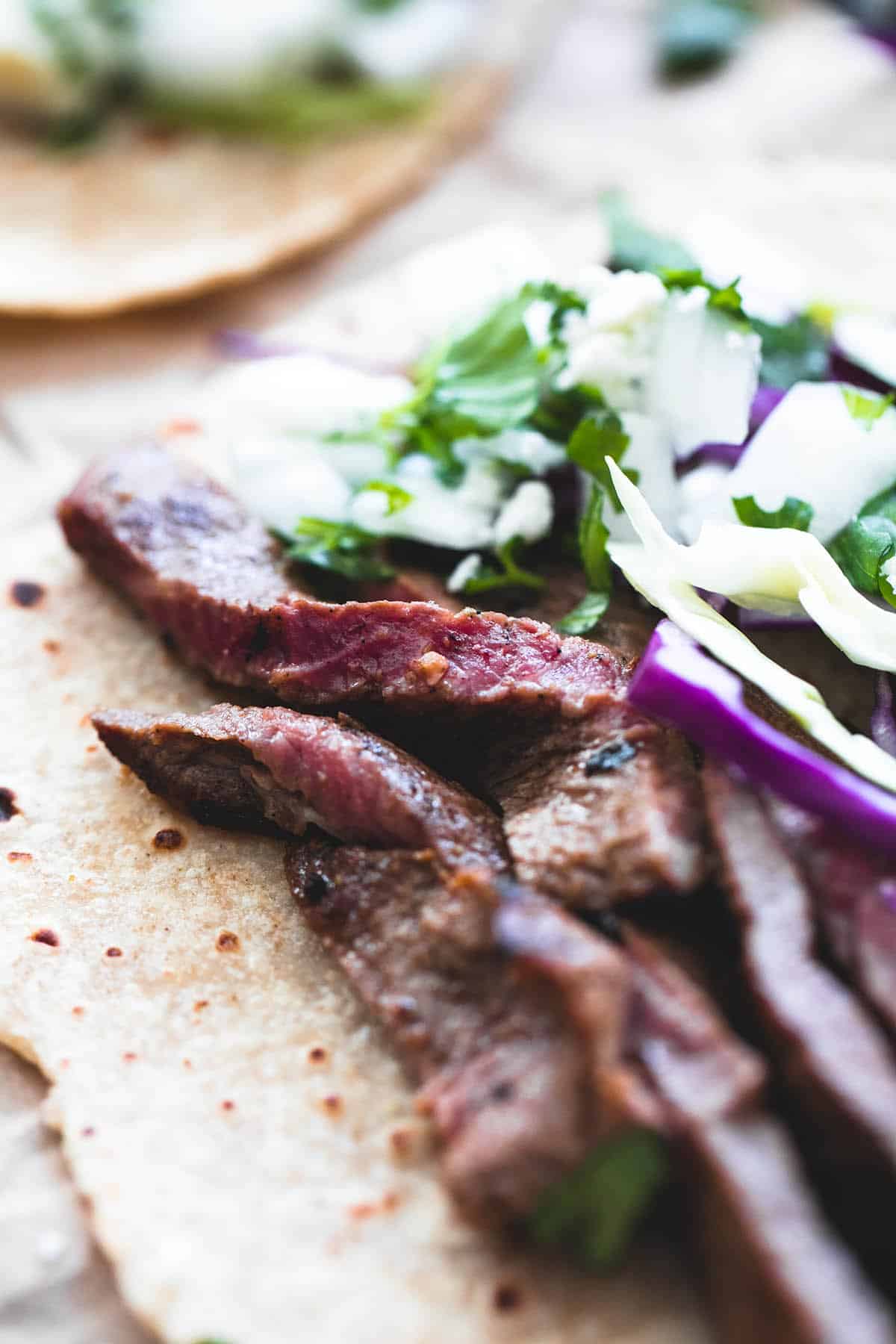 close up of a mojo steak taco.