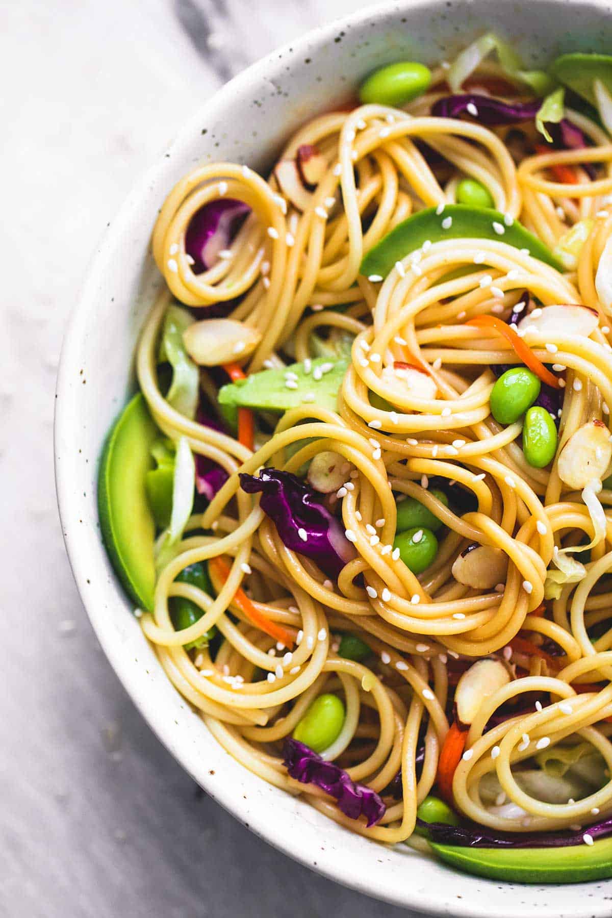 top view of Asian spaghetti salad with sesame ginger dressing in a bowl.
