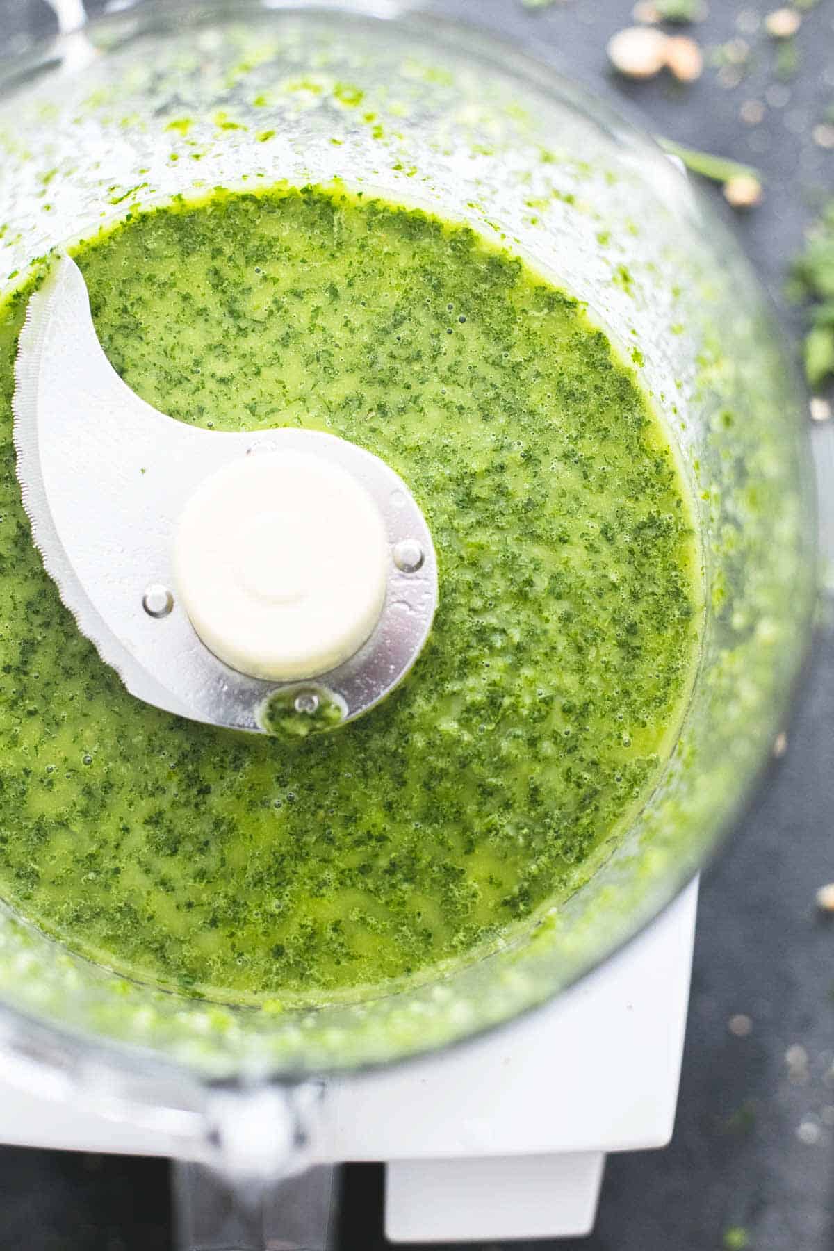 close up top view of cilantro lime dressing in a blender.