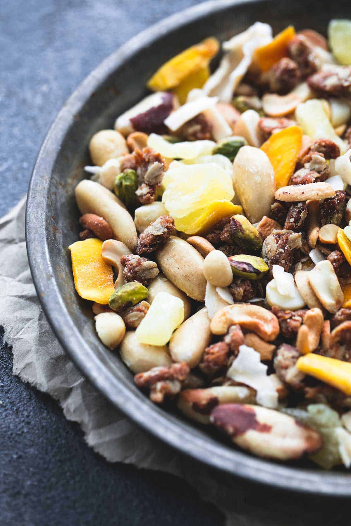 close up of tropical trail mix in a bowl.
