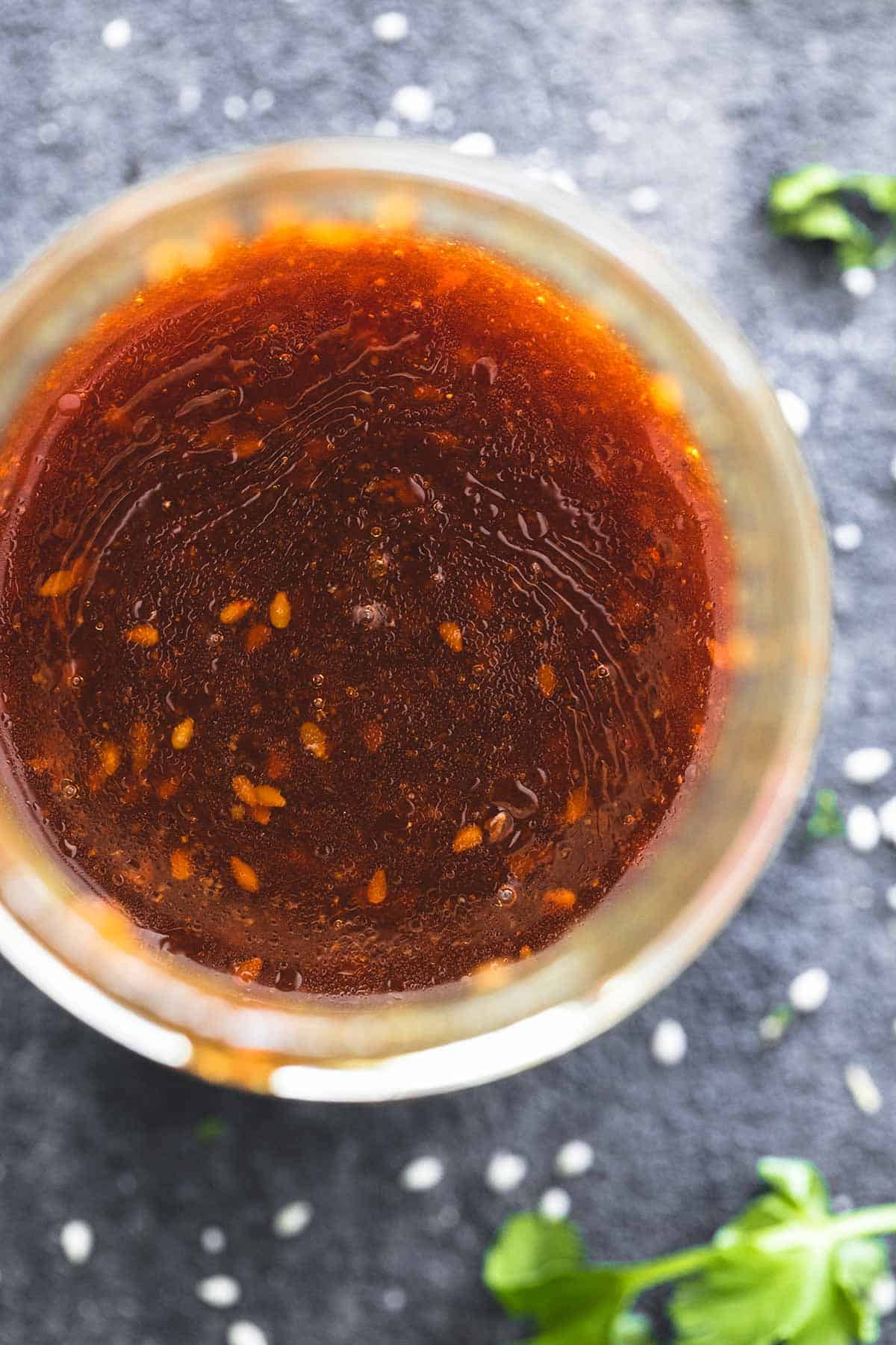 close up top view of teriyaki vinaigrette in a jar. 