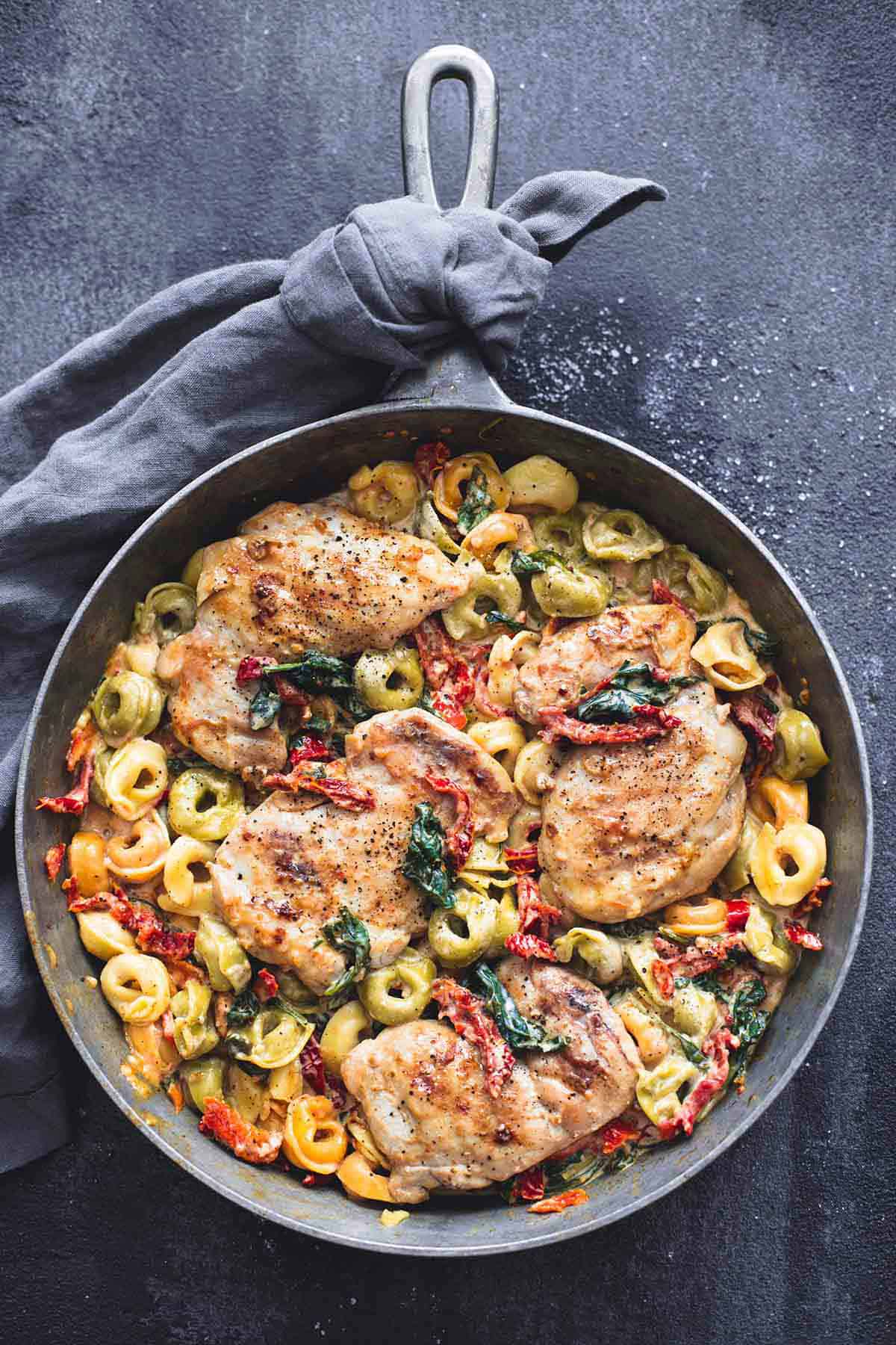 top view of Tuscan garlic chicken tortellini in a pan.