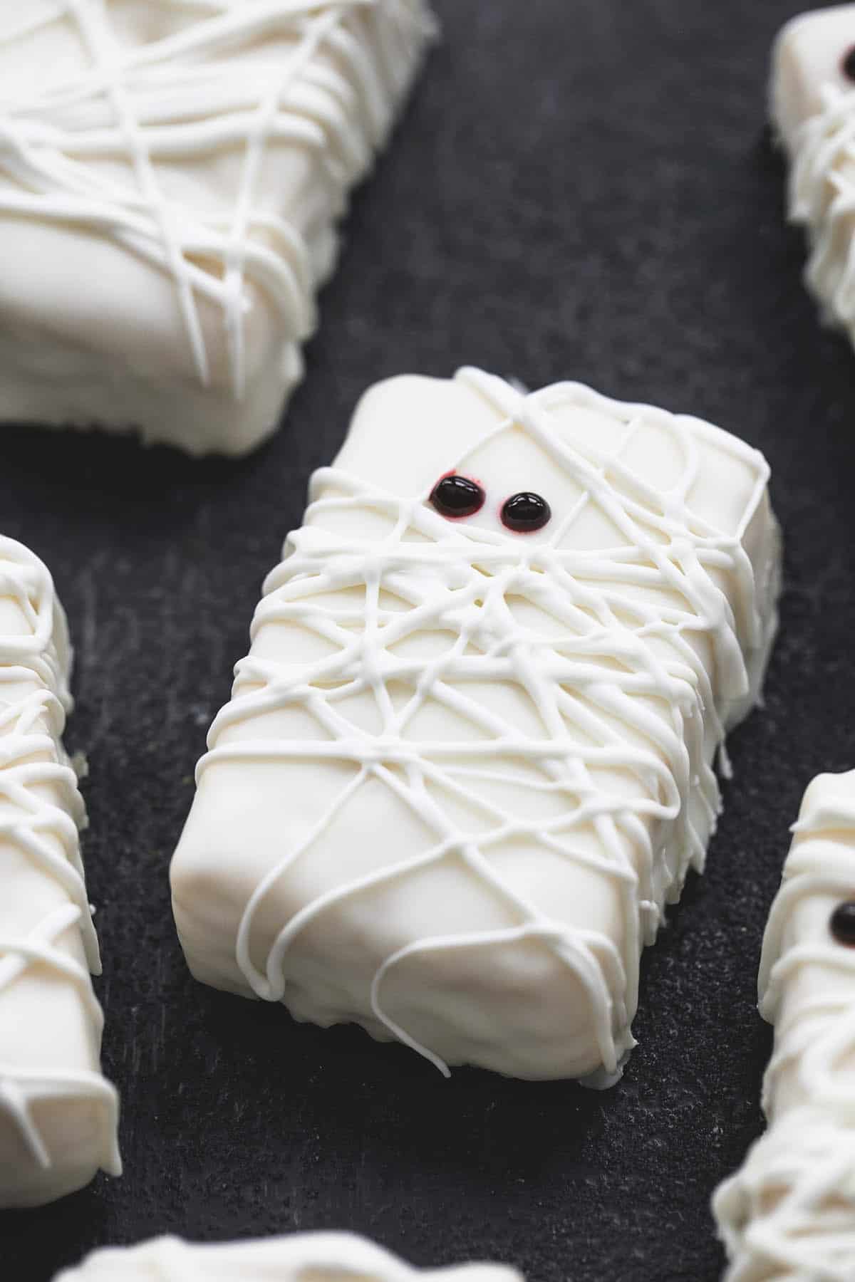 a rice krispie treat mummy surrounded by more mummies.