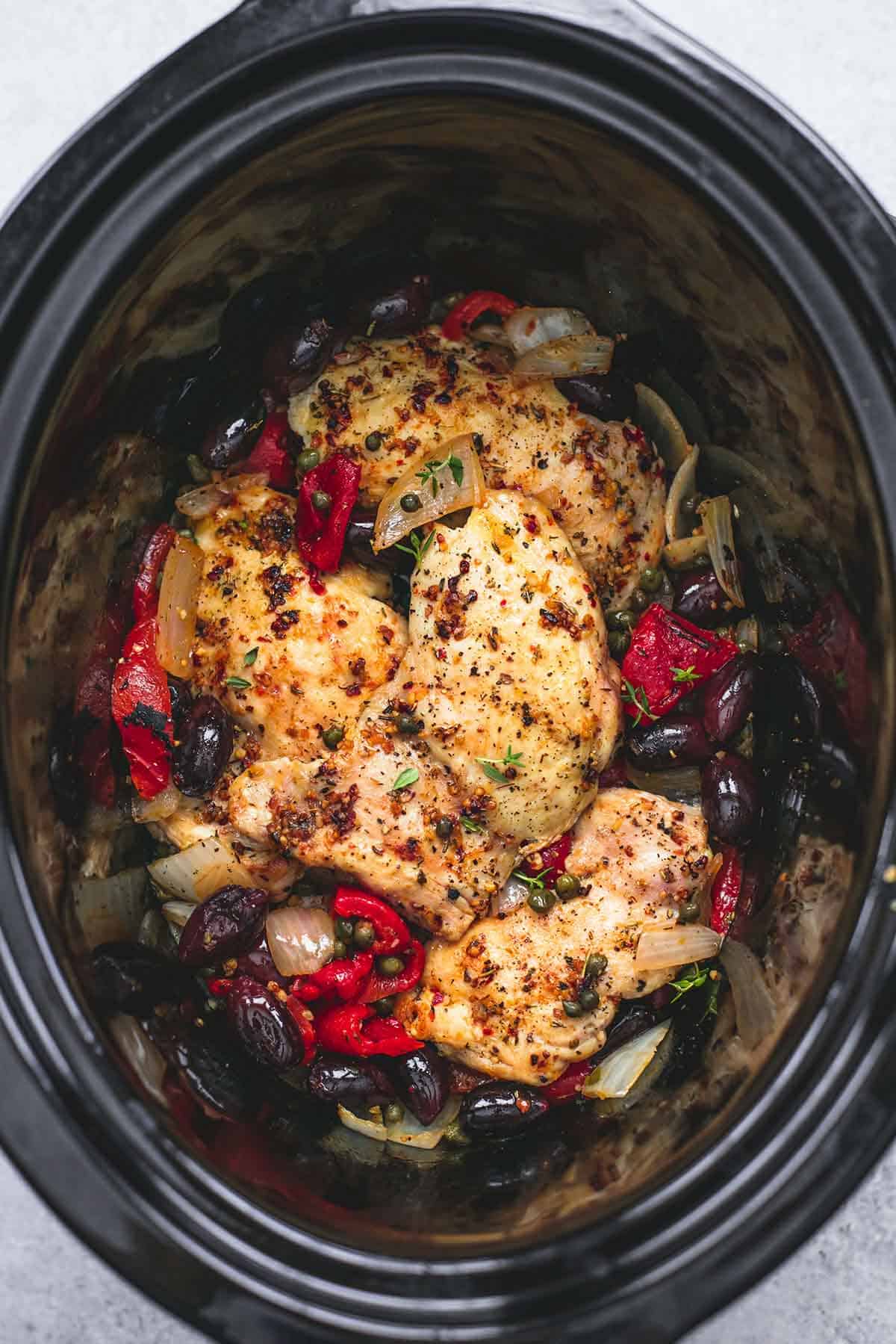 top view of slow cooker Mediterranean chicken in a slow cooker.
