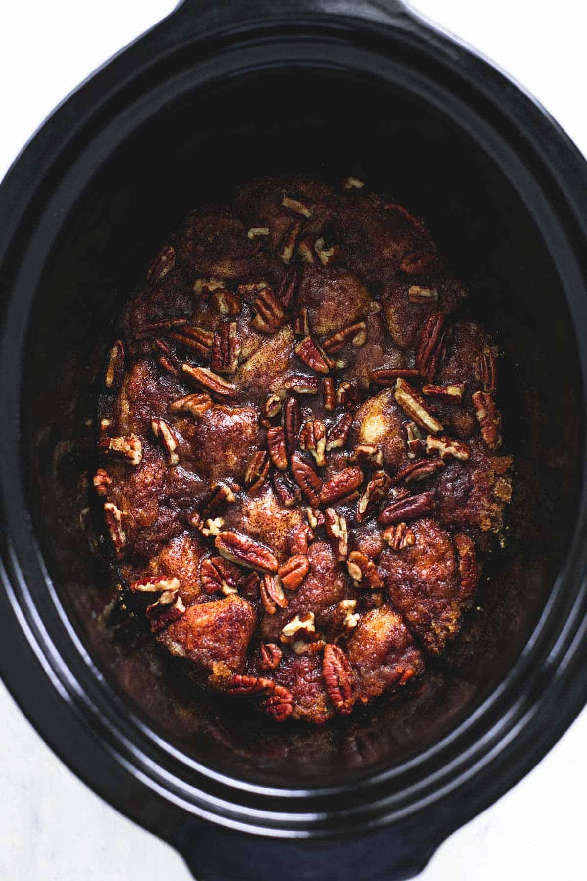 top view of slow cooker caramel pecan monkey bread in a slow cooker.