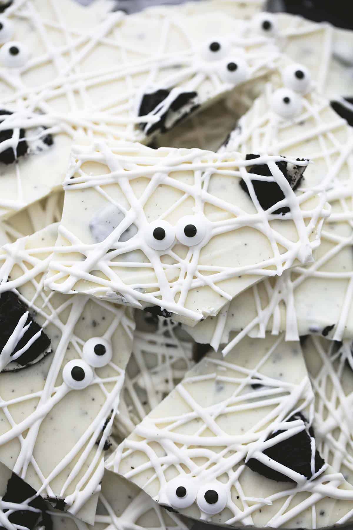 top view of white chocolate bark with pieces of Oreo and candy eyes. 