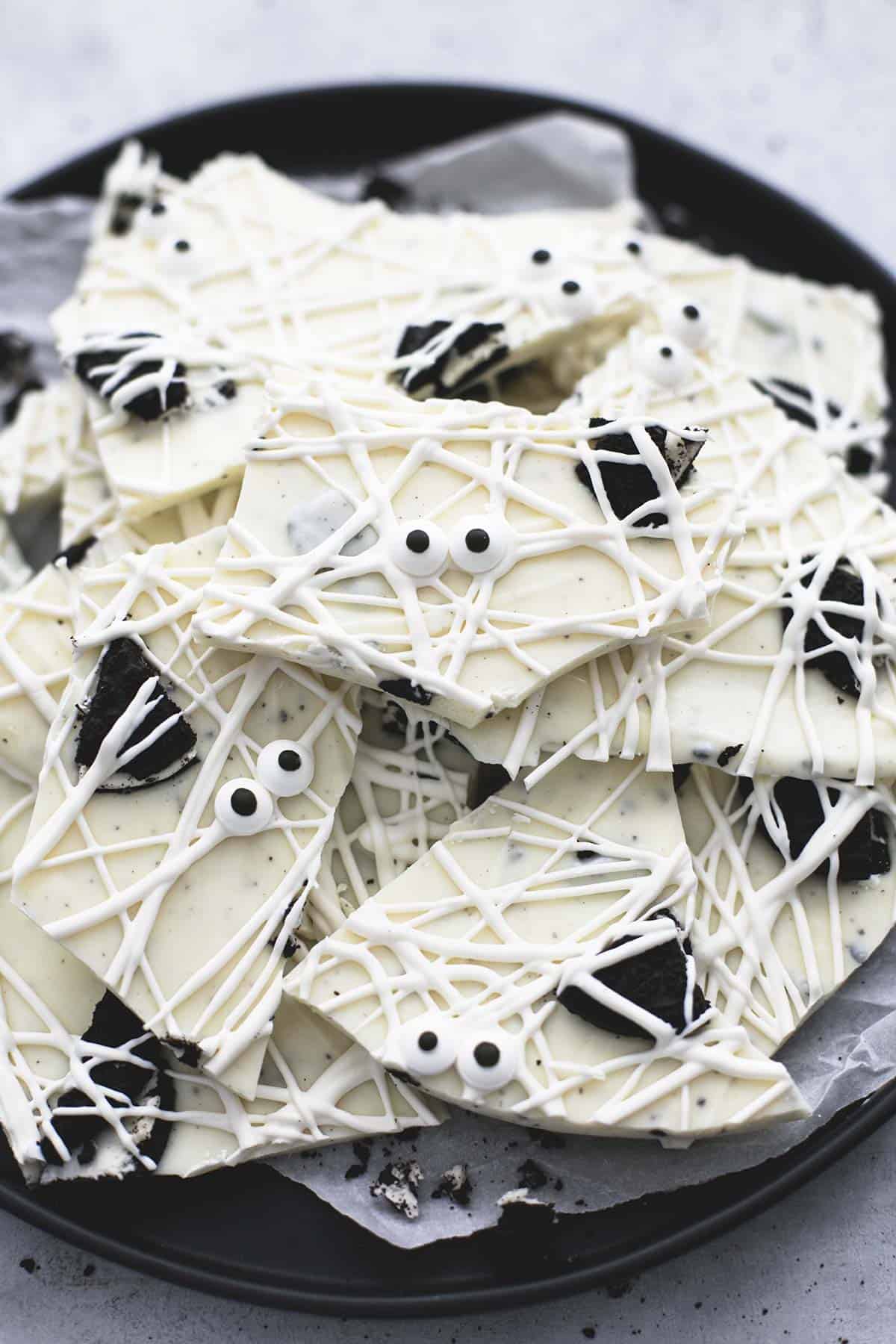 close up of a bunch of cookies 'n cream mummy bark on a plate.