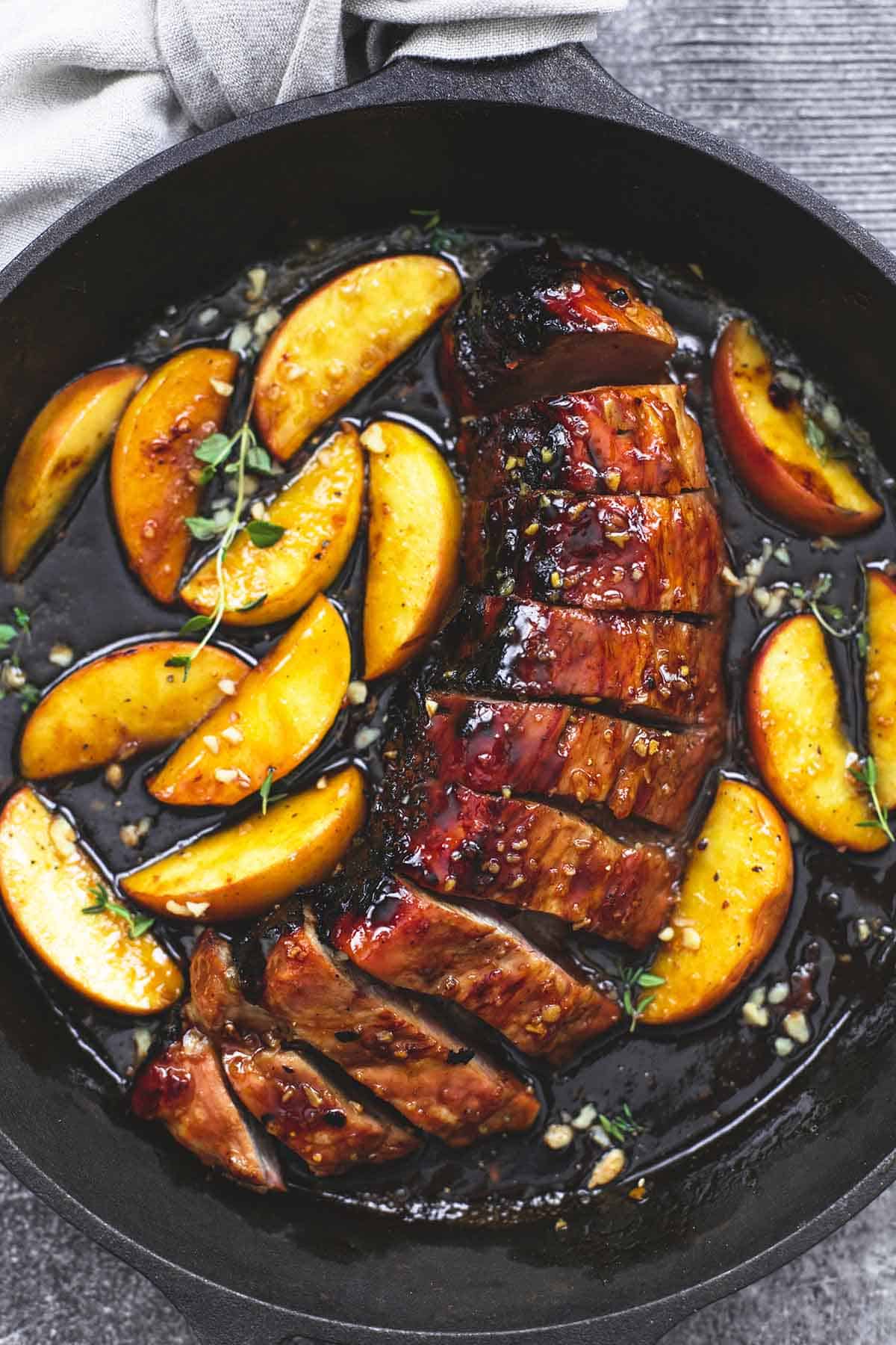 top view of brown sugar pork & apples in a cast iron.