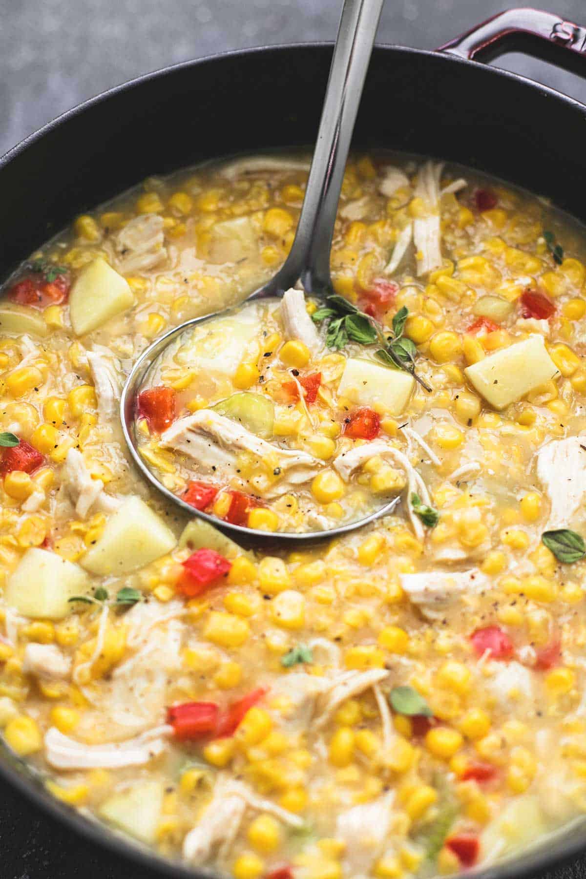 leftover turkey corn chowder with a serving spoon in a pan.