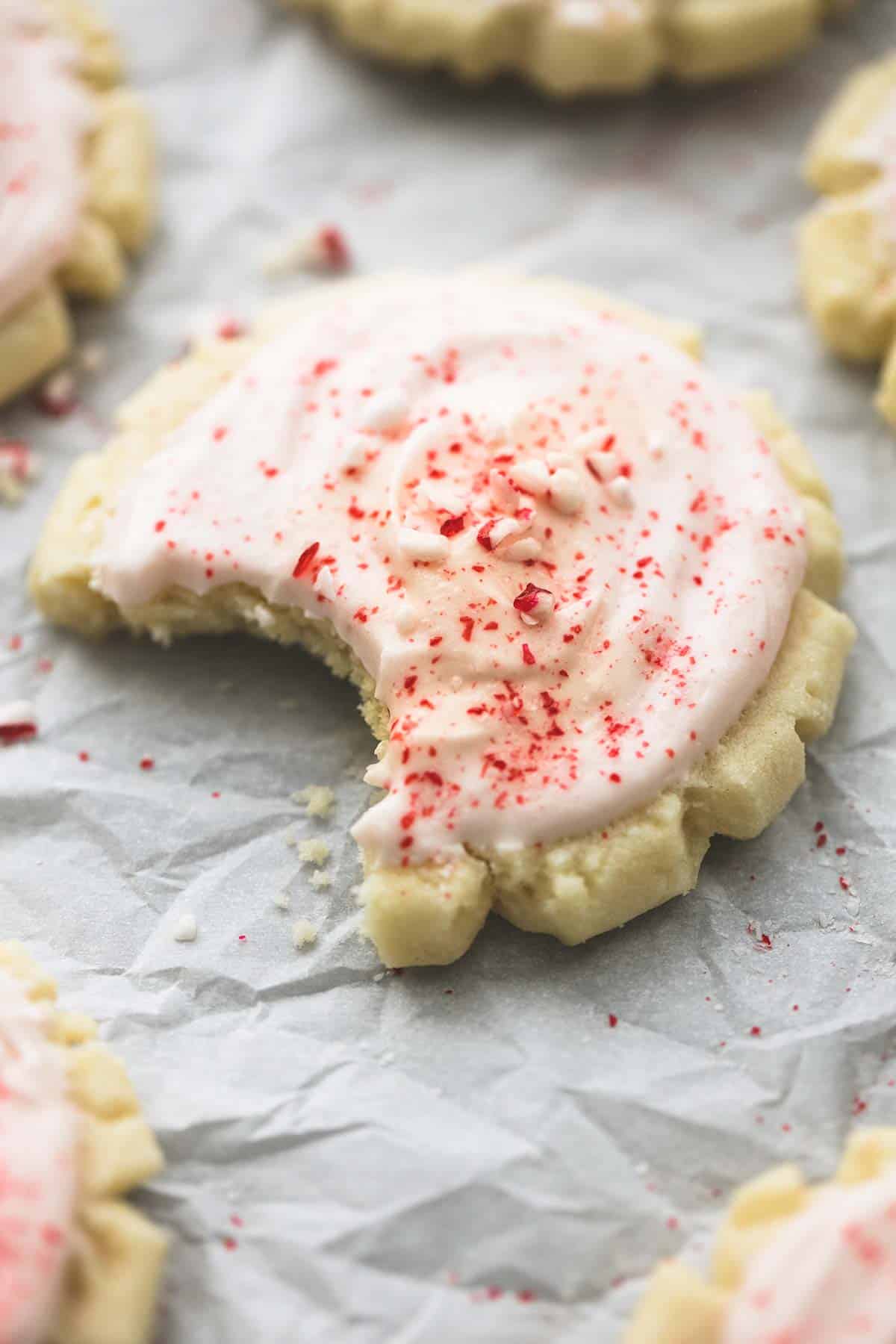 a peppermint sugar cookie with a bite missing.