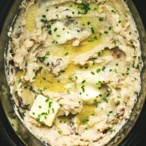 Close up overhead of slow cooker mashed potatoes in a slow cooker.