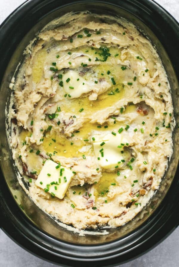Close up overhead of slow cooker mashed potatoes in a slow cooker.