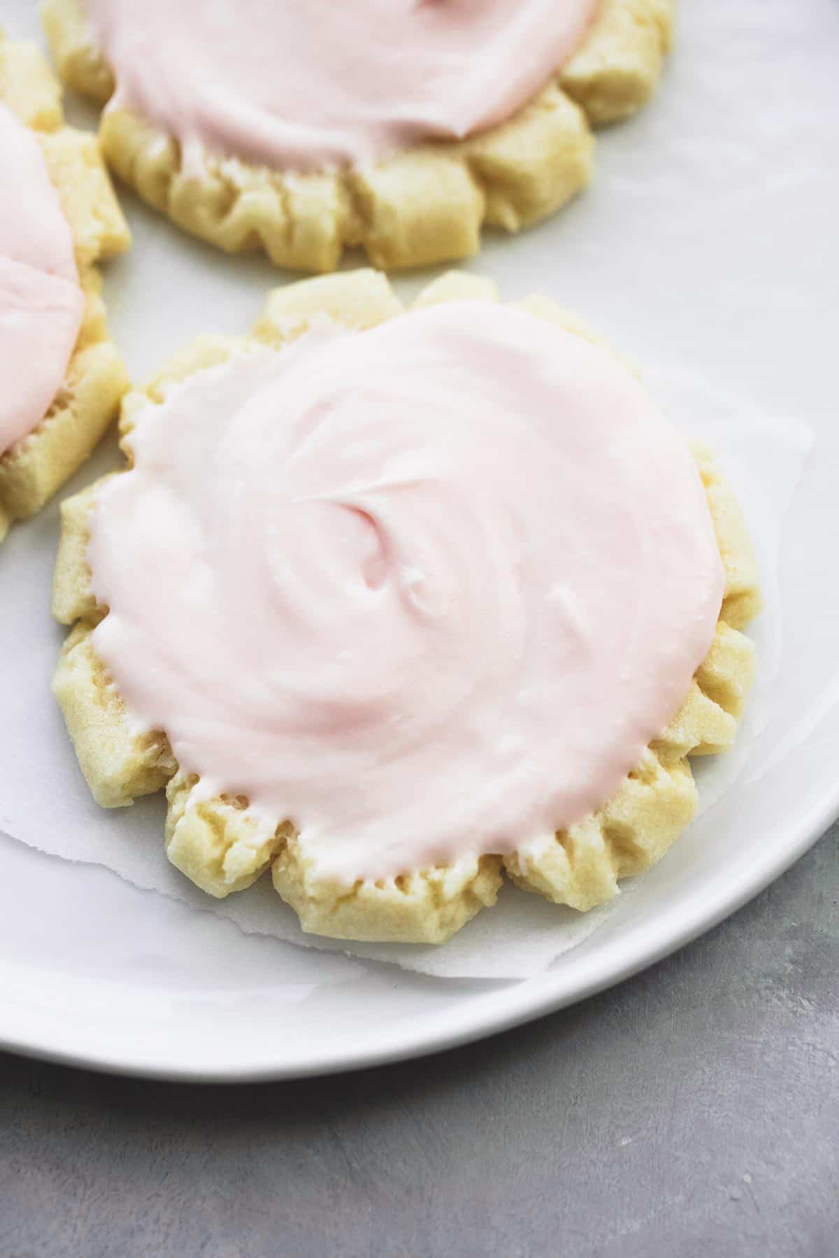 top view of a copycat Swig sugar cookie with more cookies on the side all on a plate.