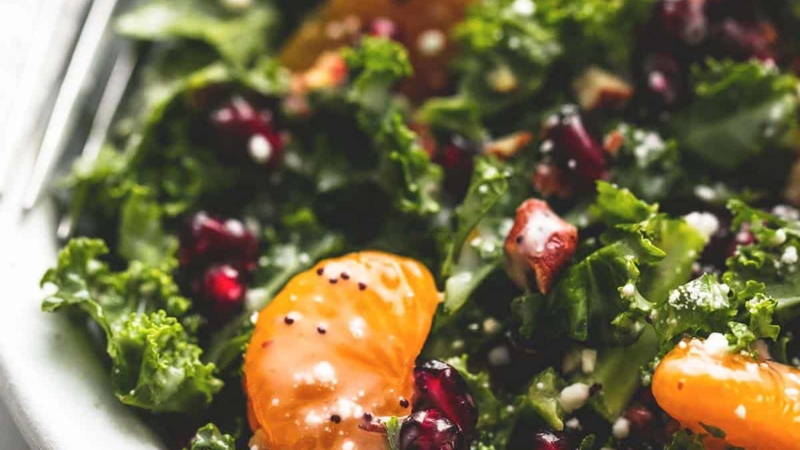 Mandarin Pomegranate Chopped Kale Salad with Lemony Poppyseed Dressing | lecremedelacrumb.com