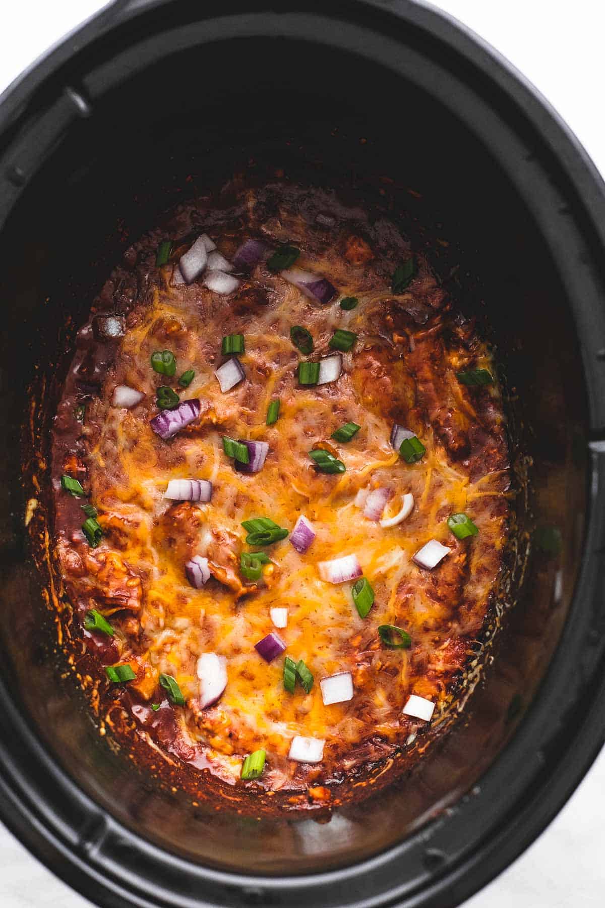 top view of slow cooker bbq chicken dip in a slow cooker.