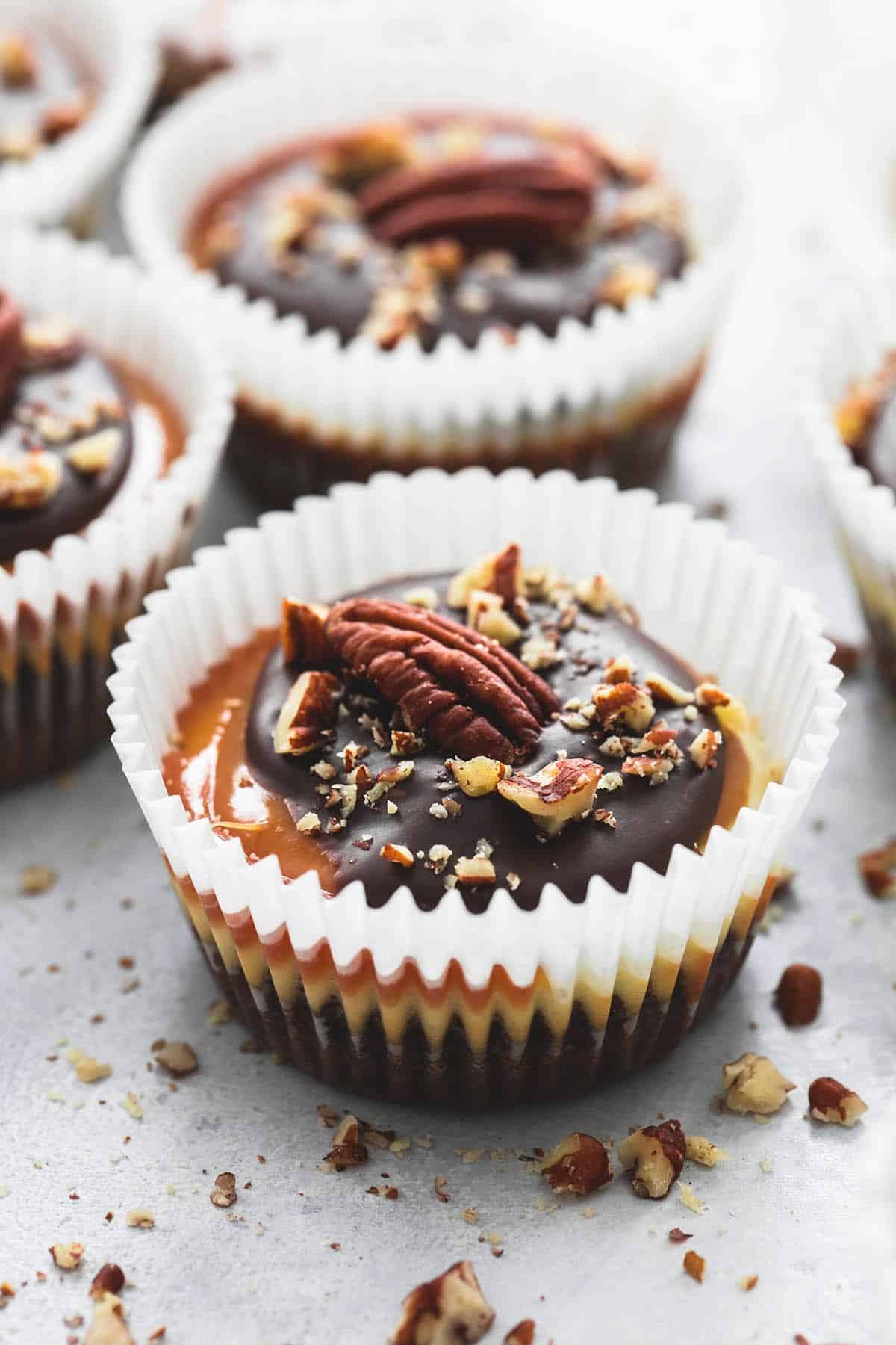 a mini turtle cheesecake with more in the background.