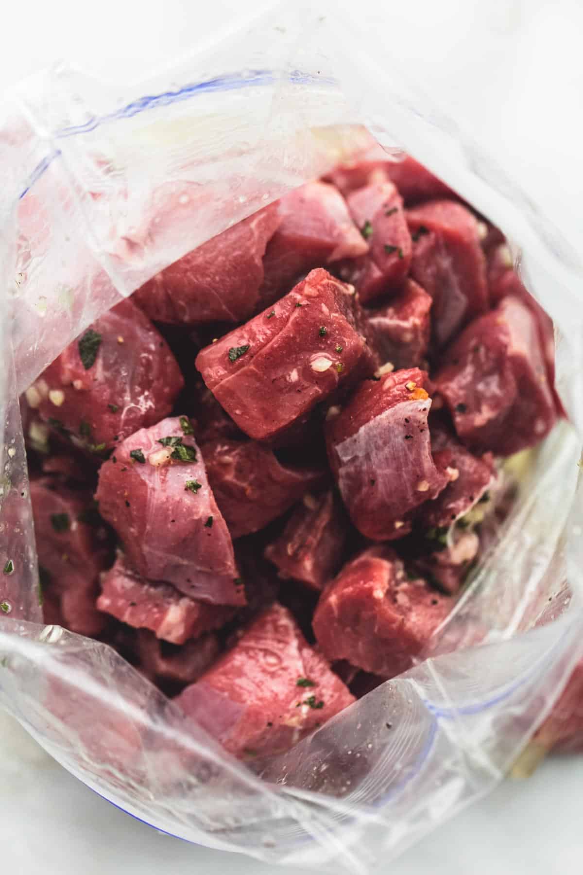 beef Souvlaki kebabs uncooked in a zip lock bag.