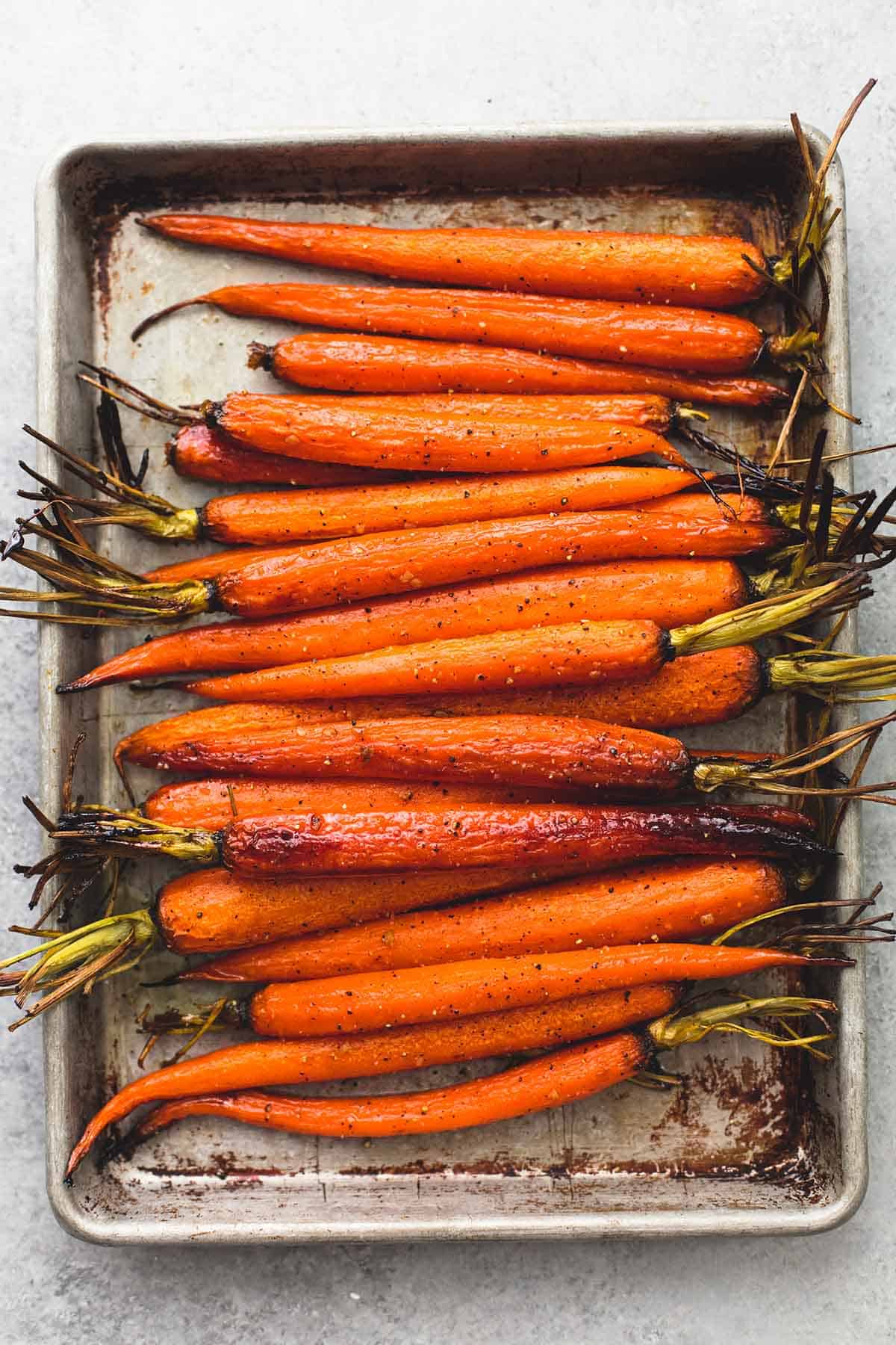 top view of honey brown sugar roasted carrots on a baking sheet.
