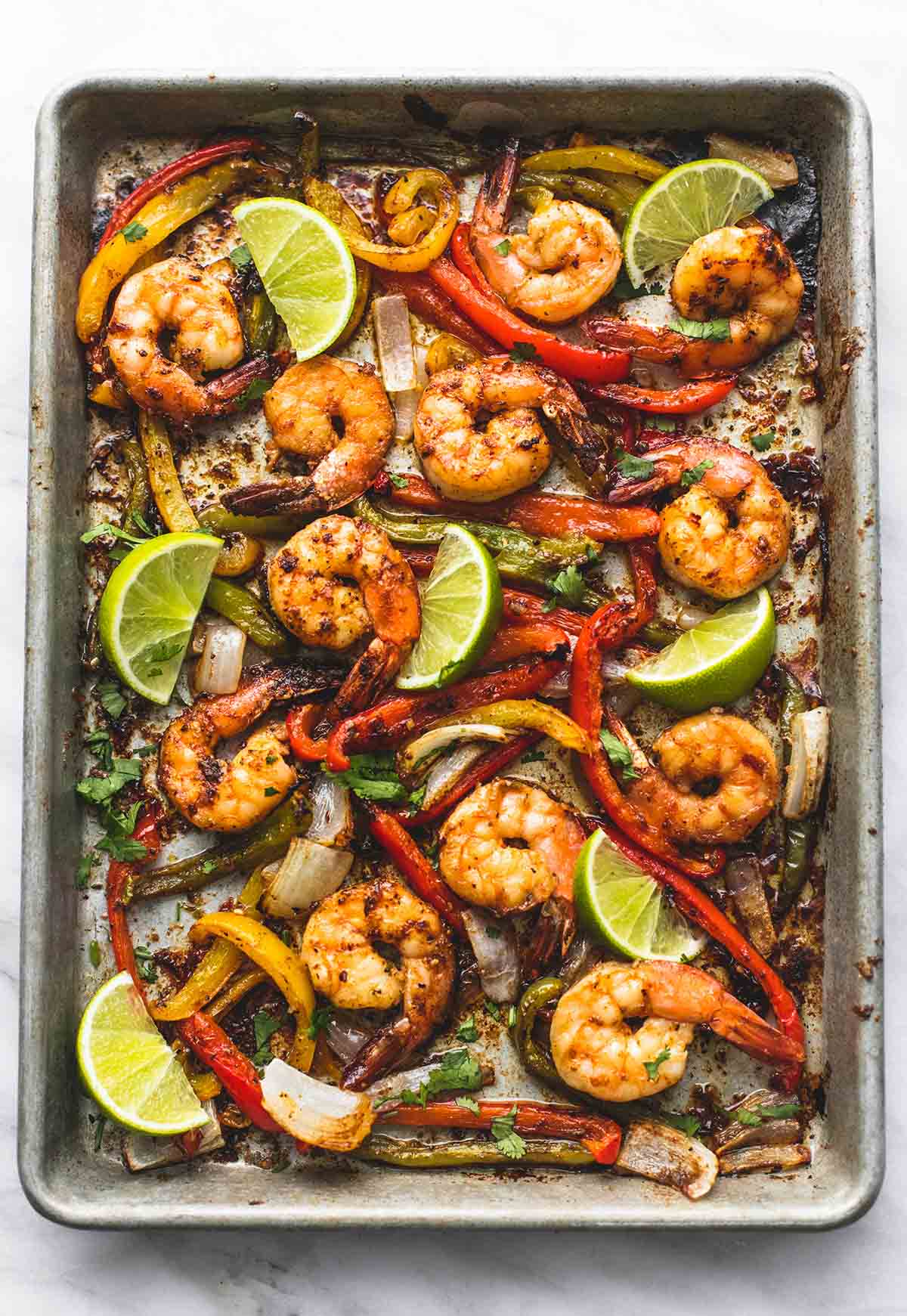 top view of Chili lime shrimp fajitas on a baking sheet.