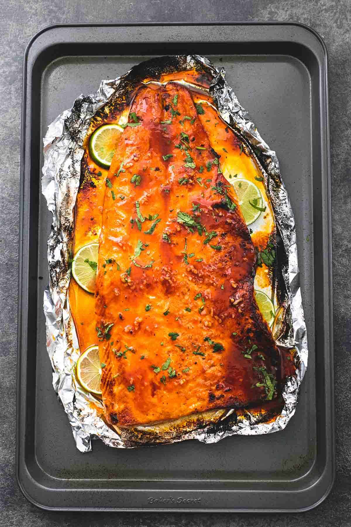 top view of baked honey sriracha lime salmon on a baking sheet.